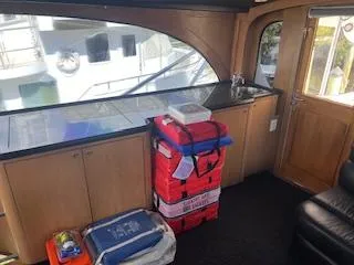 Slide: The Image of Interior of 2000 Buddy Davis 78 yacht with storage and seating area. - 44