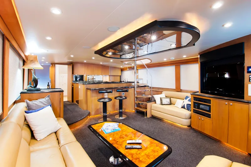 Slide: The Image of Luxurious interior of 2000 Buddy Davis 78 yacht with modern furnishings and entertainment area. - 6