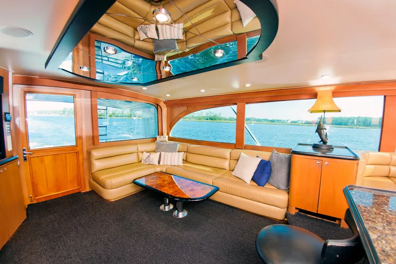 Slide: The Image of Luxurious interior of 2000 Buddy Davis 78 yacht with leather seating and scenic windows. - 10