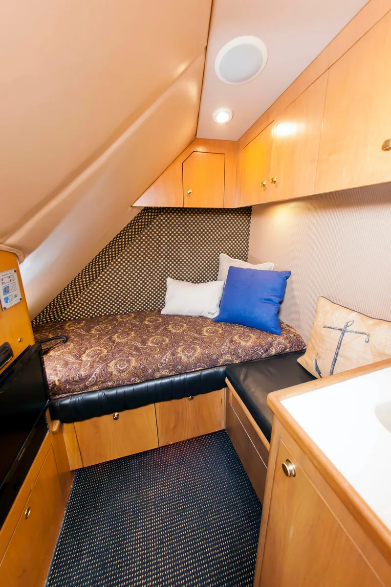 Slide: The Image of Cozy cabin interior of 2000 Buddy Davis 78 yacht with bed and storage. - 14