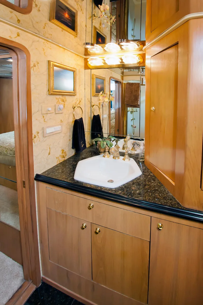 Slide: The Image of Luxurious bathroom interior of 2000 Buddy Davis 78 yacht with elegant wood cabinetry. - 15