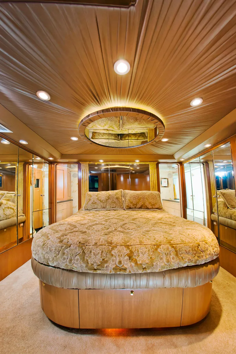Slide: The Image of Luxurious bedroom interior of 2000 Buddy Davis 78 yacht with elegant lighting and decor. - 18