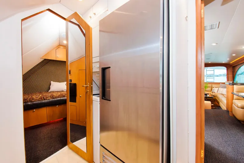 Slide: The Image of Interior of 2000 Buddy Davis 78 yacht, featuring modern kitchen and cozy cabin. - 22