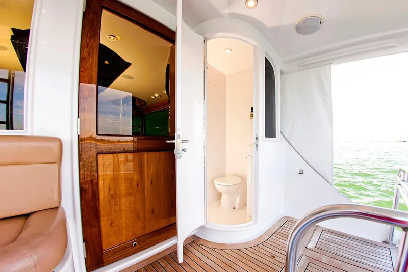 Slide: The Image of Luxury yacht interior with wooden door and compact bathroom, Buddy Davis 78, 2000 model. - 27