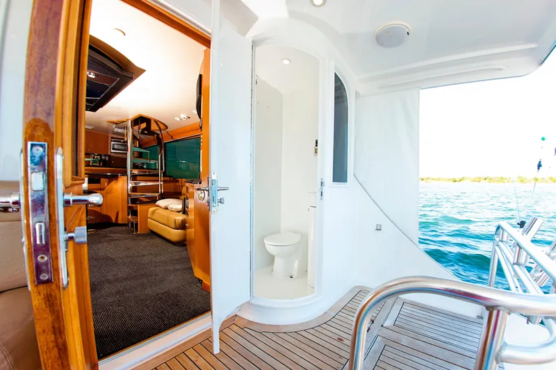 Slide: The Image of Interior view of 2000 Buddy Davis 78 yacht with open door and ocean backdrop. - 28
