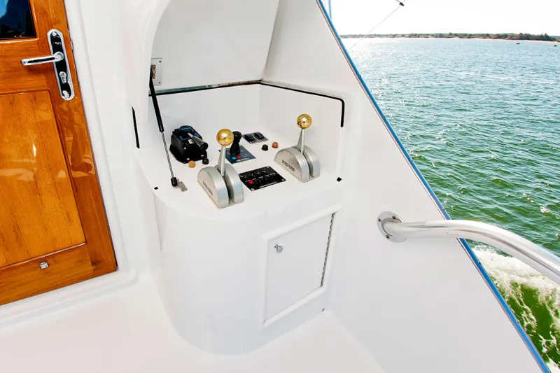 Slide: The Image of Control panel on a 2000 Buddy Davis 78 yacht, overlooking the ocean. - 29