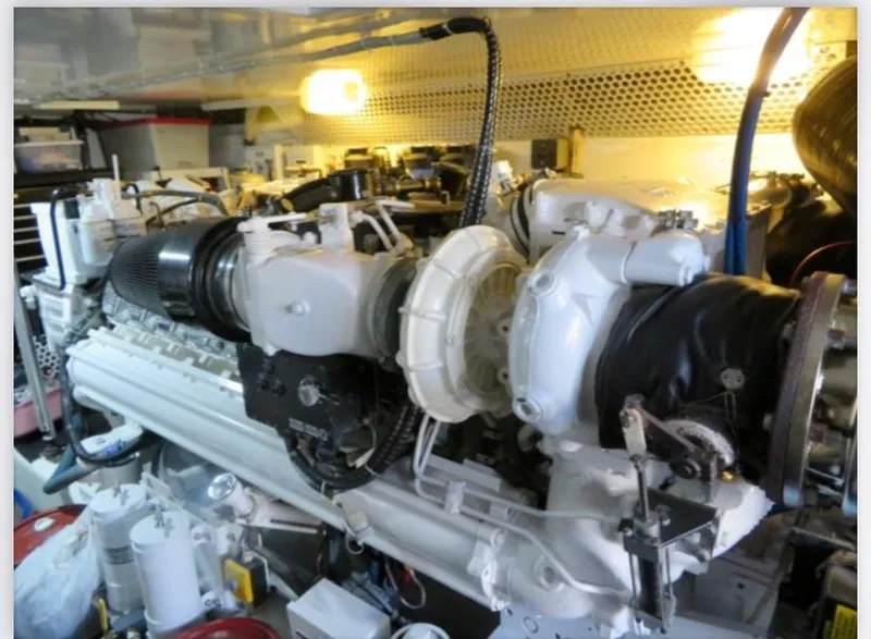 Slide: The Image of Engine room of a 2000 Buddy Davis 78 yacht, showcasing mechanical components. - 30