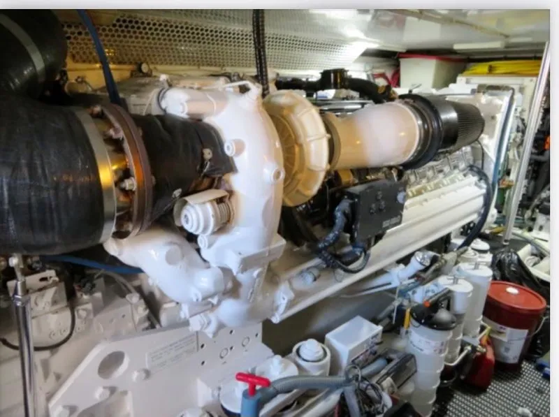 Slide: The Image of Engine room of 2000 Buddy Davis 78 yacht, showcasing detailed machinery and components. - 32