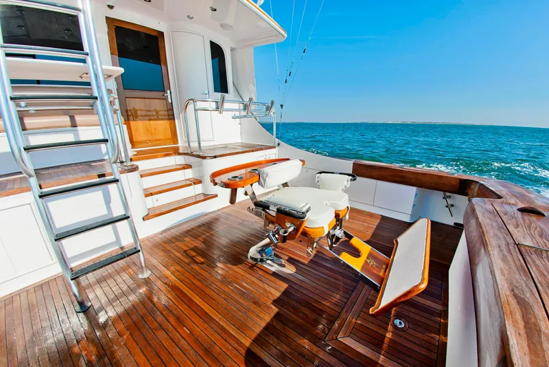 Slide: The Image of Luxurious 2000 Buddy Davis 78 yacht deck with wooden flooring and ocean view. - 5