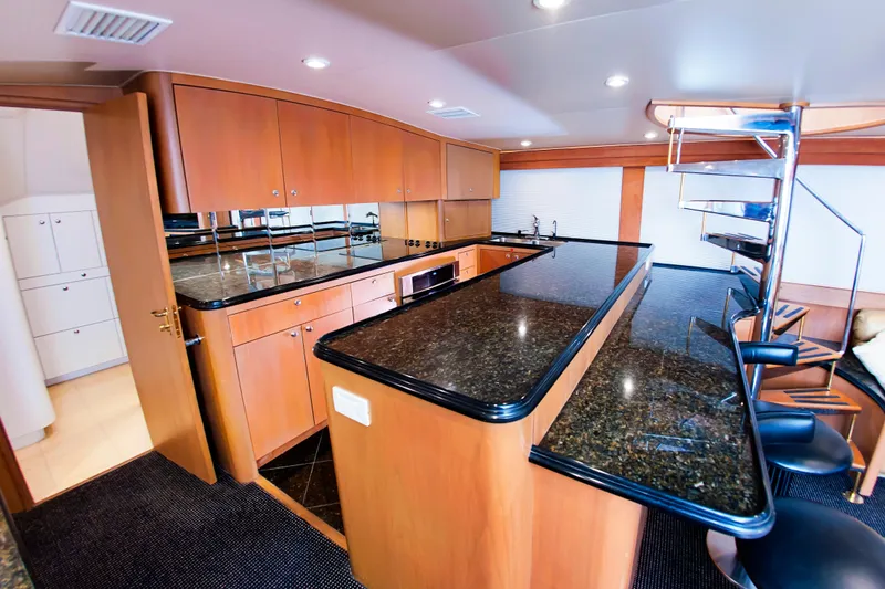 Slide: The Image of Luxurious kitchen interior of 2000 Buddy Davis 78 yacht with granite countertops. - 7