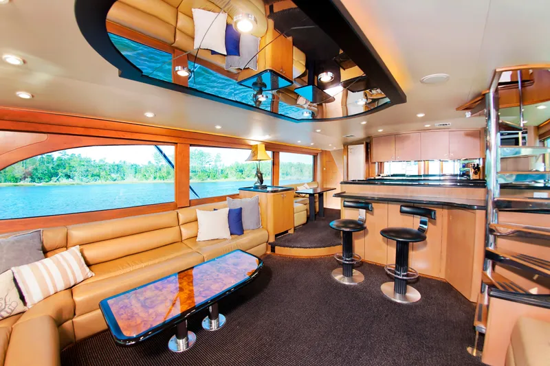 Slide: The Image of Luxurious interior of 2000 Buddy Davis 78 yacht with modern seating and bar area. - 9