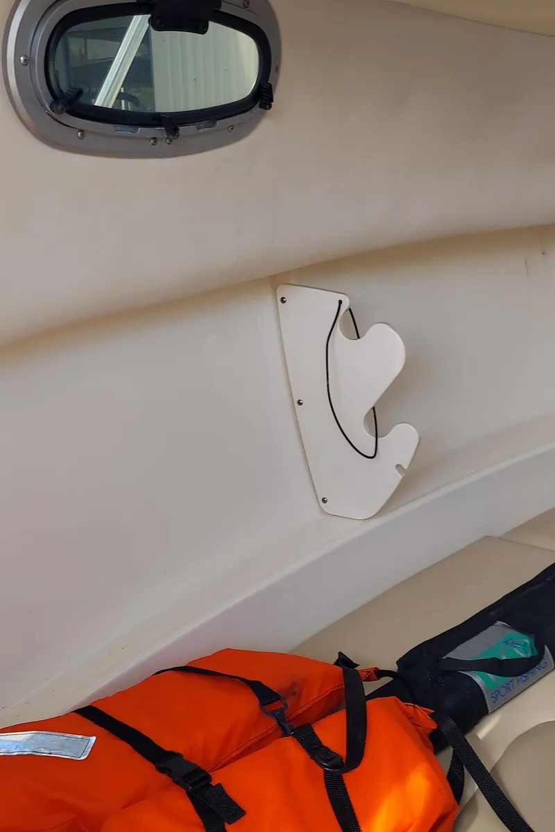 Slide: The Image of Interior of 2006 Boston Whaler 235 Conquest with life jacket and window. - 15