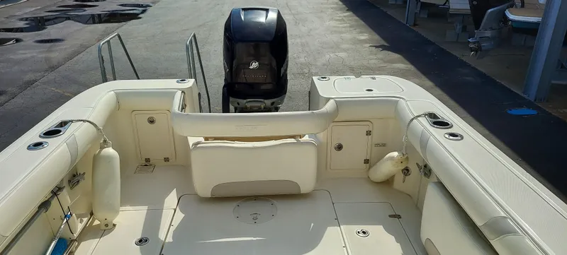 Slide: The Image of 2006 Boston Whaler 235 Conquest boat interior with outboard motor. - 6