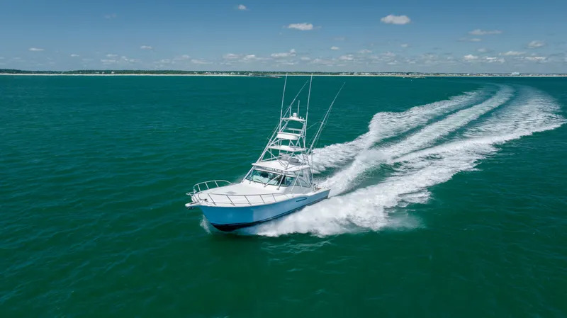 Slide: The Image of 2019 Albemarle 410 Express Fisherman cruising on open water. - 15