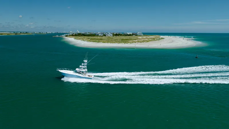 Slide: The Image of 2019 Albemarle 410 Express Fisherman cruising near a scenic island. - 23