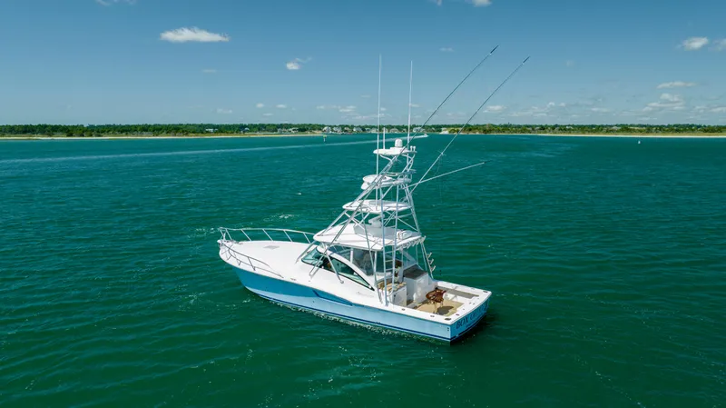 Slide: The Image of 2019 Albemarle 410 Express Fisherman boat on open water. - 3