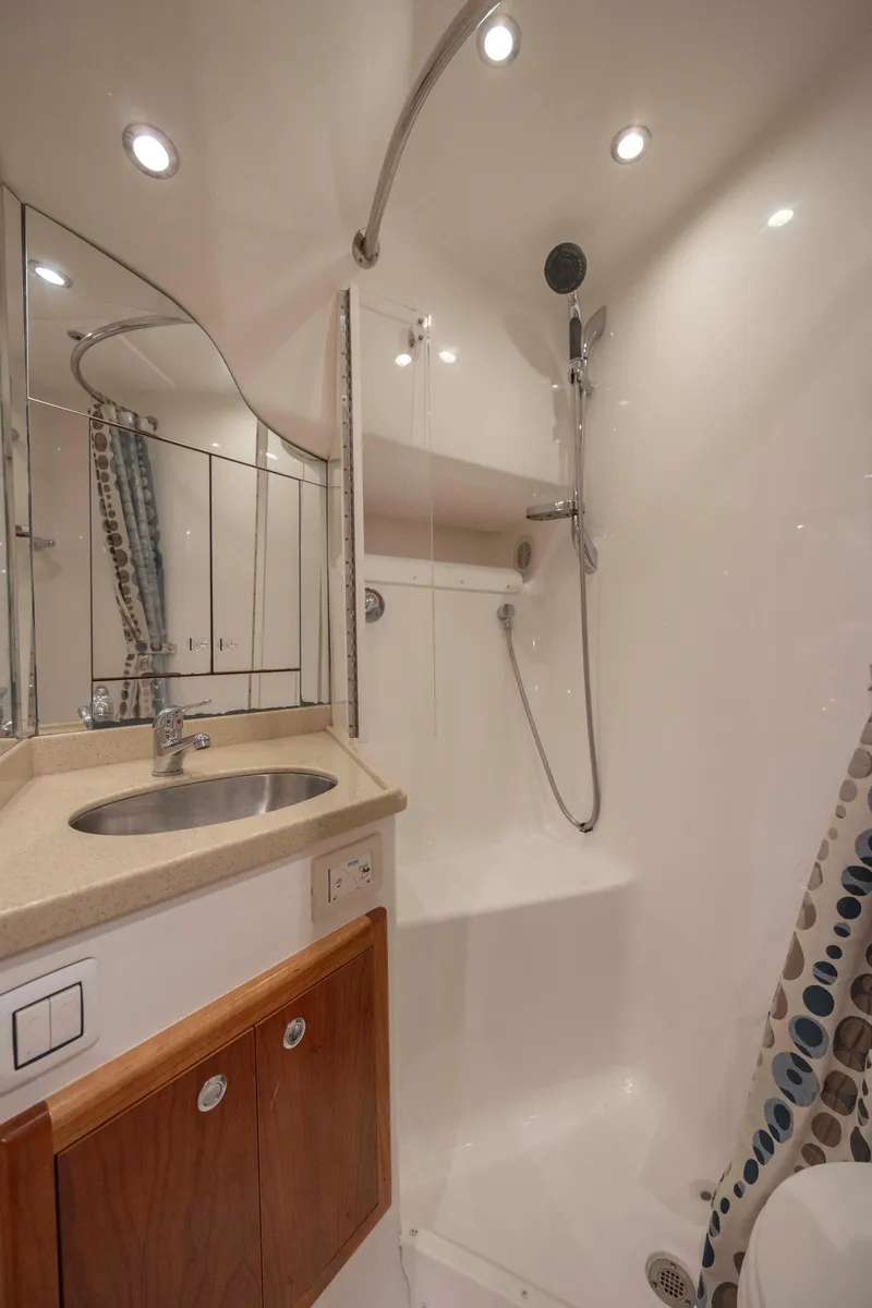 Slide: The Image of 2019 Albemarle 410 Express Fisherman bathroom with shower, sink, and storage cabinets. - 31