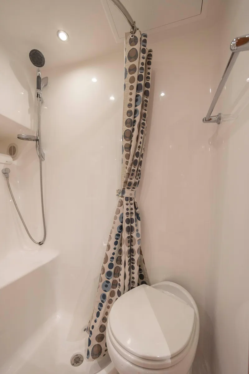 Slide: The Image of 2019 Albemarle 410 Express Fisherman bathroom with shower and toilet. - 32