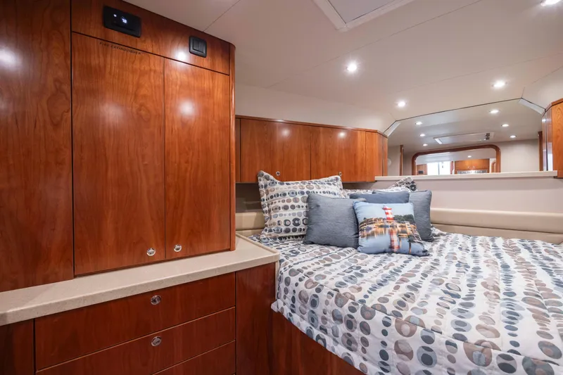 Slide: The Image of 2019 Albemarle 410 Express Fisherman cabin with bed and wooden cabinetry. - 38