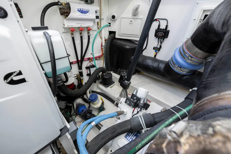 Slide: The Image of Engine room of a 2019 Albemarle 410 Express Fisherman boat with various mechanical components. - 47