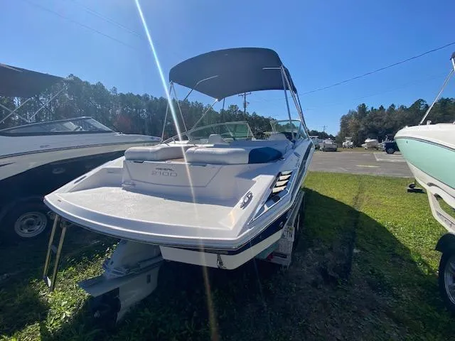 Slide: The Image of 2012 Regal 2100 boat with canopy in outdoor storage. - 5