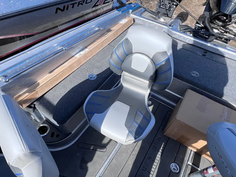 Slide: The Image of 2024 Nitro ZV20 boat interior with gray and blue seating. - 10