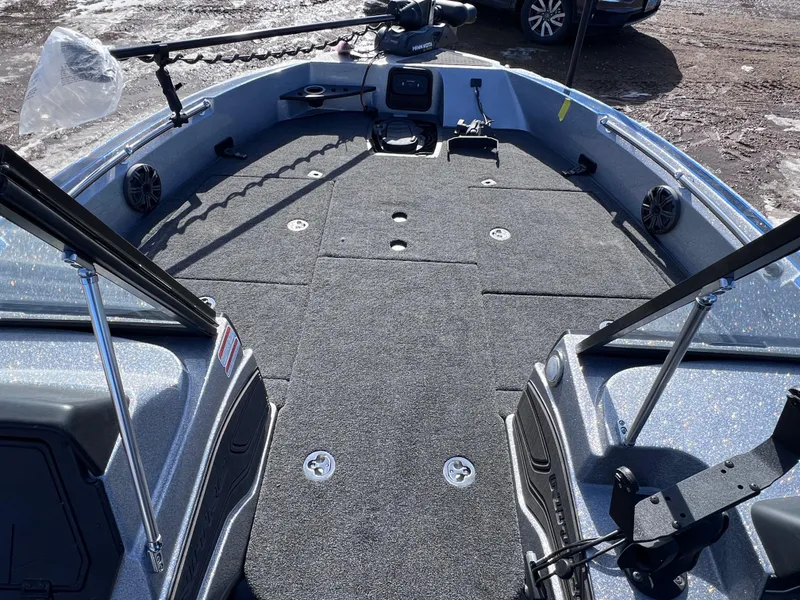 Slide: The Image of 2024 Nitro ZV20 fishing boat deck with mounted equipment and storage compartments. - 14