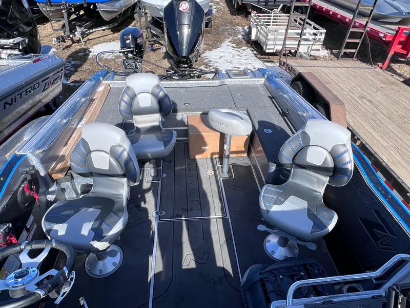 Slide: The Image of 2024 Nitro ZV20 fishing boat interior with four seats and outboard motor. - 17