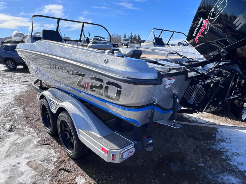Slide: The Image of 2024 Nitro ZV20 boat on a trailer in a snowy outdoor setting. - 3