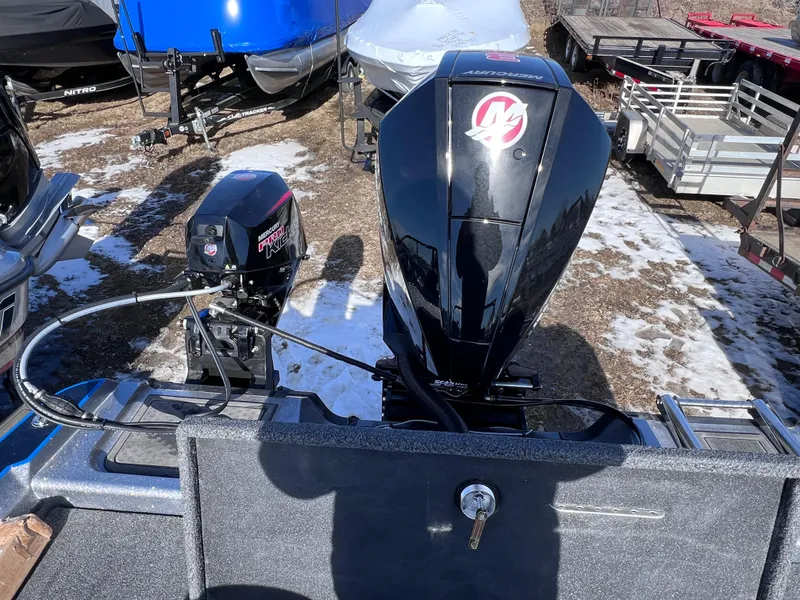 Slide: The Image of 2024 Nitro ZV20 boat with Mercury outboard motor in a snowy outdoor setting. - 4