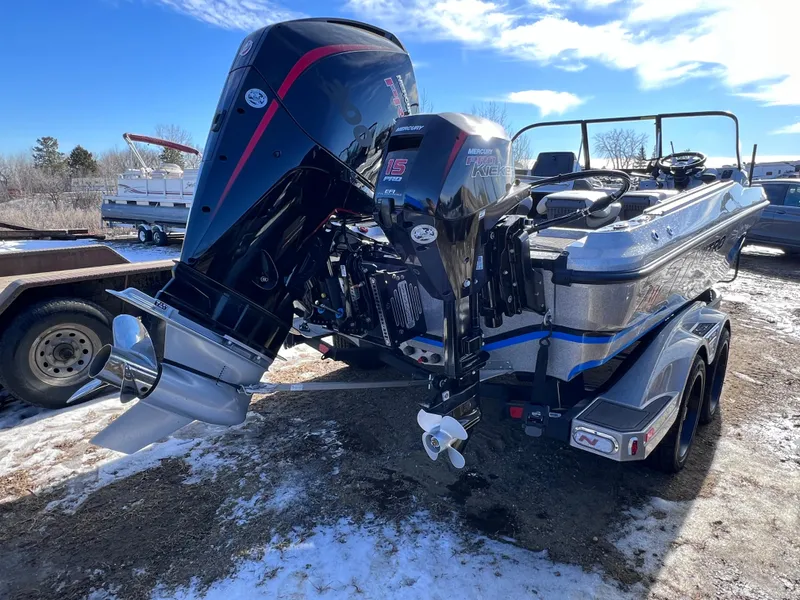 Slide: The Image of 2024 Nitro ZV20 boat with dual outboard motors in a snowy outdoor setting. - 5
