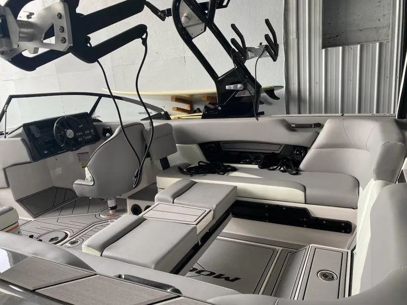 Slide: The Image of 2023 Moomba Mojo boat interior with modern seating and advanced dashboard. - 3