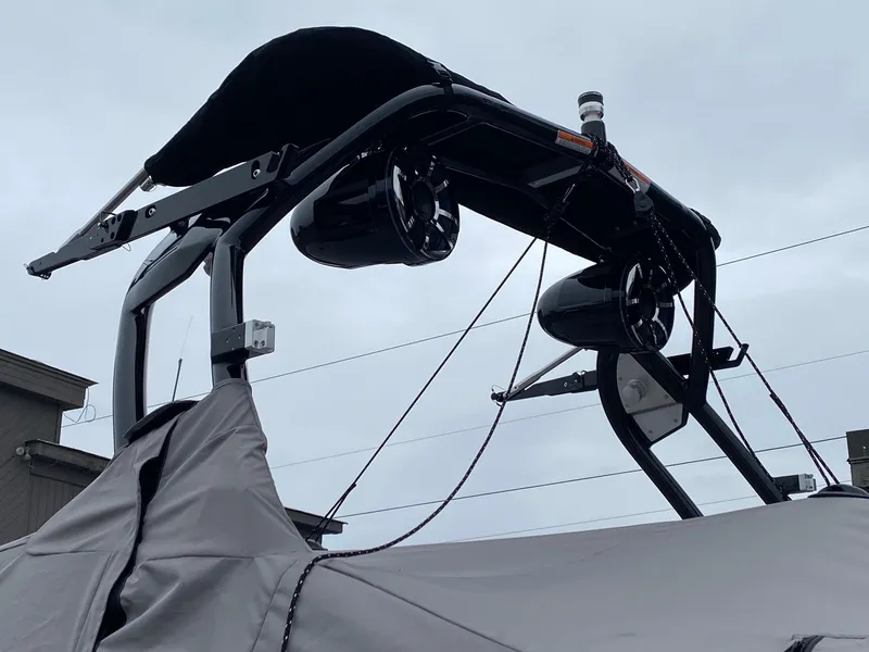 Slide: The Image of 2023 Moomba Mojo boat with tower speakers and cover. - 6