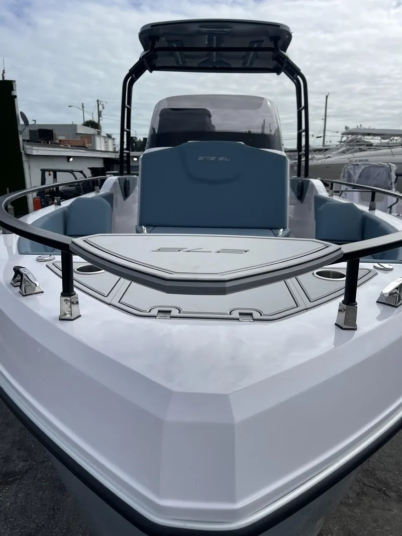 Slide: The Image of 2024 Ranieri 275 SL boat with sleek design and spacious seating area. - 14