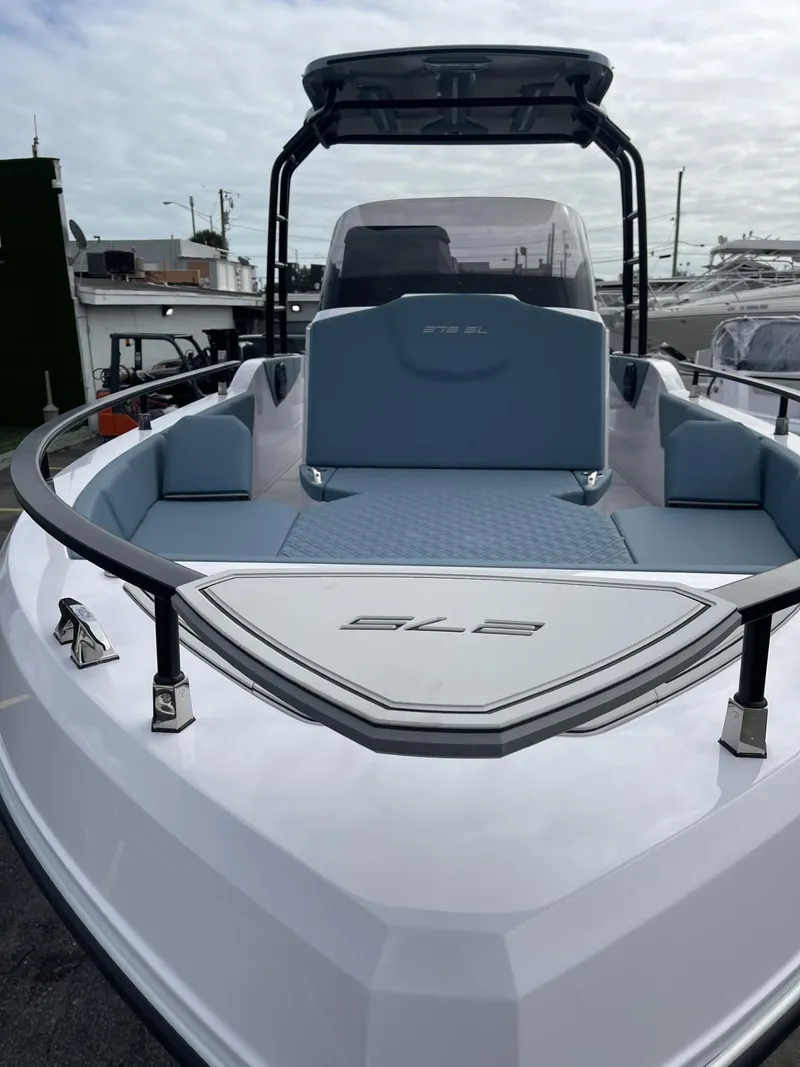Slide: The Image of 2024 Ranieri 275 SL boats on trailers, featuring dual outboard motors. - 15