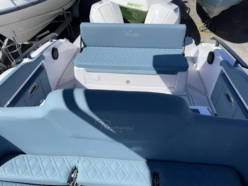 Slide: The Image of 2024 Ranieri 275 SL boat dashboard with steering wheel and control panel. - 21