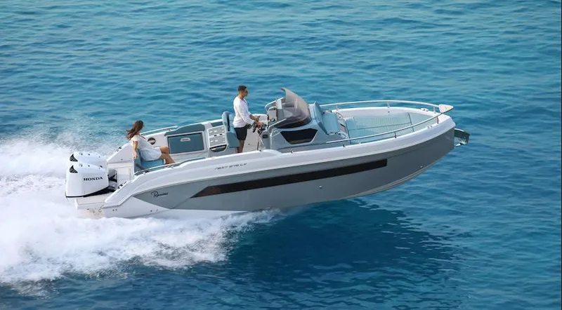 Slide: The Image of 2024 Ranieri 275 SL boat cruising on clear blue water. - 26