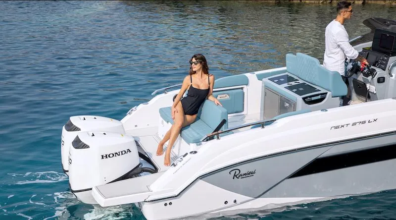 Slide: The Image of 2024 Ranieri 275 SL boat cruising on clear blue water. - 28