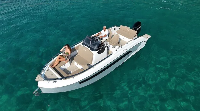 Slide: The Image of 2024 Ranieri 275 SL boat on a trailer under a clear blue sky. - 29