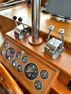 Slide: The Image of 1996 Grand Banks Classic yacht dashboard with gauges and controls. - 19