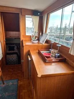 Slide: The Image of Interior of a 1996 Grand Banks Classic yacht with wooden cabinetry and nautical decor. - 22