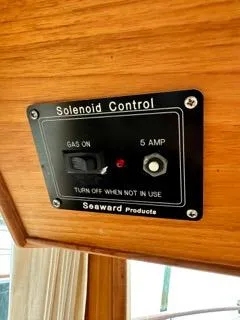 Slide: The Image of Solenoid control panel on 1996 Grand Banks Classic boat, featuring gas and 5 amp switch. - 40