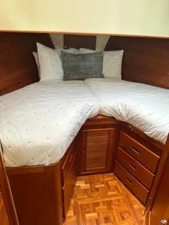 Slide: The Image of 1996 Grand Banks Classic cabin with cozy twin beds and wooden storage drawers. - 44