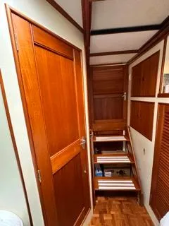 Slide: The Image of Interior of 1996 Grand Banks Classic yacht with wooden doors and stairs. - 45