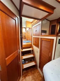 Slide: The Image of Interior of 1996 Grand Banks Classic yacht with wooden stairs and cabinetry. - 8