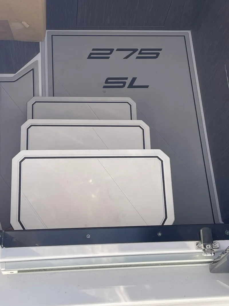 Slide: The Image of 2024 Ranieri 23S boat steps with 275 SL branding. - 7
