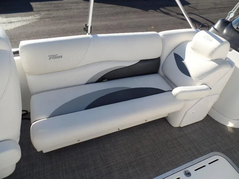 Slide: The Image of 2017 JC Sporttoon 28TT boat interior seating with white and gray upholstery. - 10