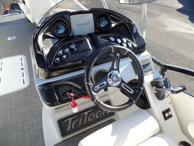 Slide: The Image of 2017 JC Sporttoon 28TT boat dashboard with Garmin navigation system. - 15