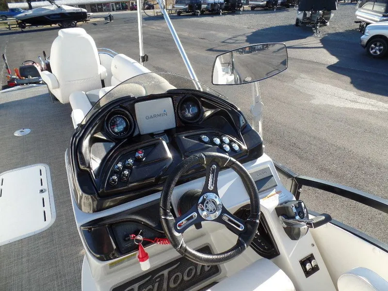 Slide: The Image of 2017 JC Sporttoon 28TT boat dashboard with Garmin navigation system. - 16