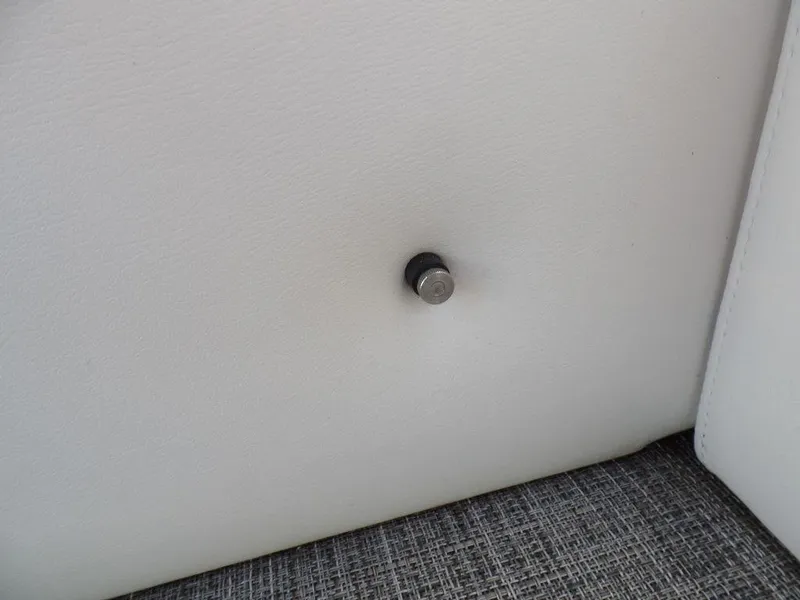 Slide: The Image of Button detail on white upholstery of 2017 JC Sporttoon 28TT boat. - 22